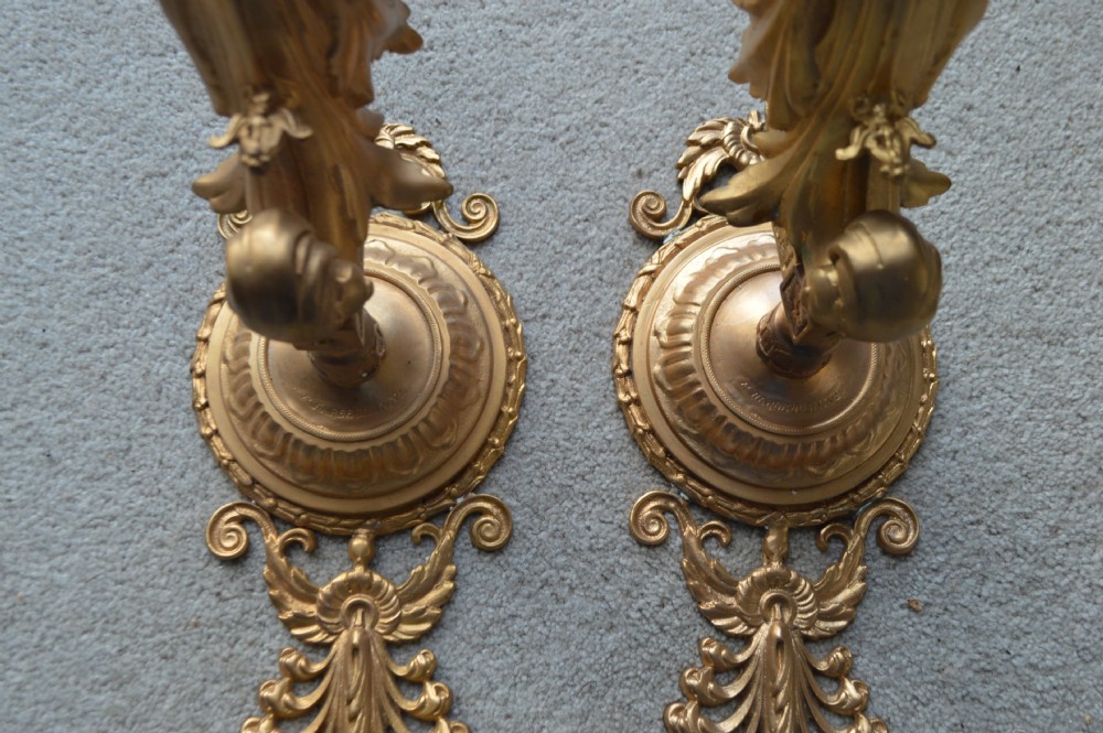 A pair of Neoclassical gilt metal wall light brackets shaped as female figures terminating in acanthus leaf scrolls. View IX