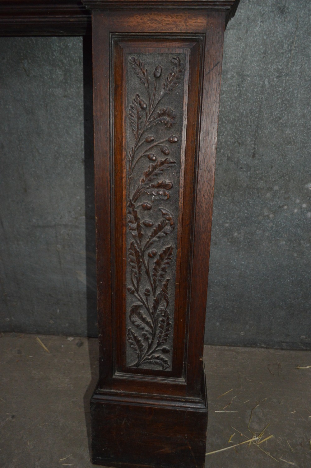 A Victorian carved oak fire surround. View V