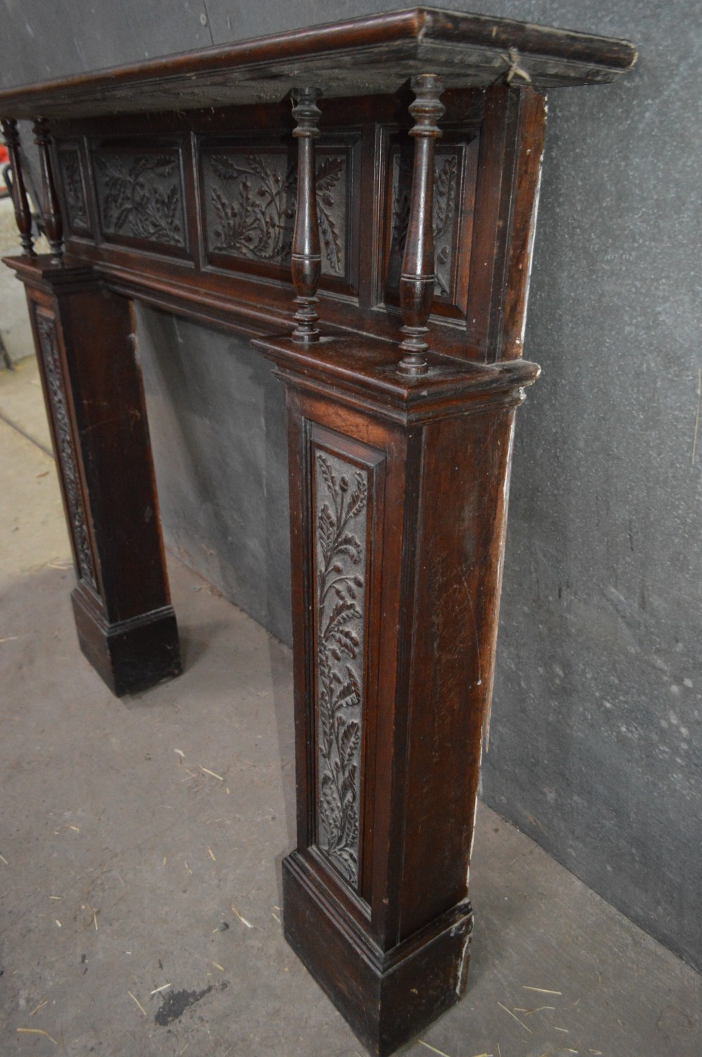 A Victorian carved oak fire surround. View VI