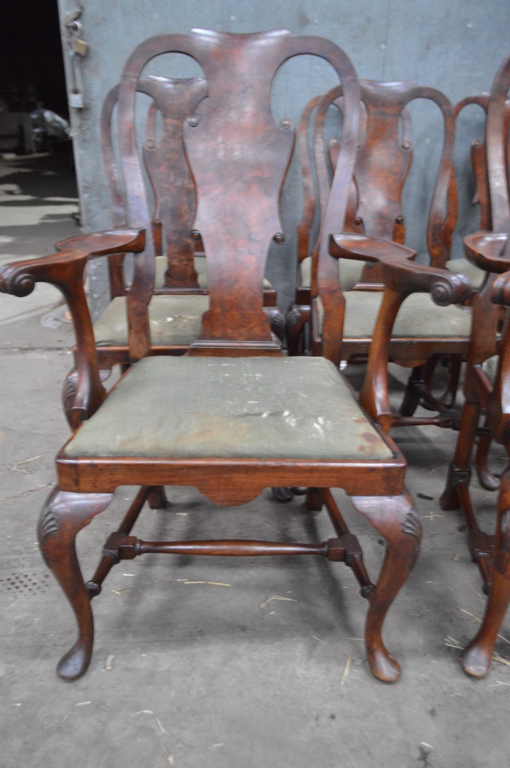 A set of George II burr walnut dining chairs featuring shaped vasiform back splats, upholstered drop-in seats, and cabriole legs. View III