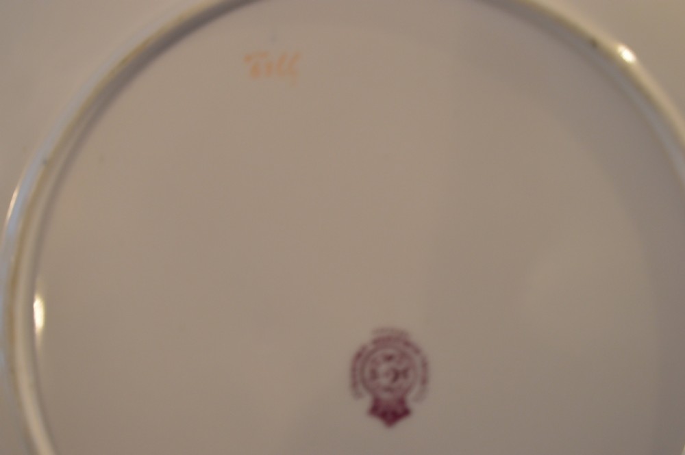 A circular Royal Worcester porcelain cabinet plate featuring a central hand-painted scene of game birds in flight surrounded by a dark cobalt blue rim with gold scrollwork gilding. View XXVII