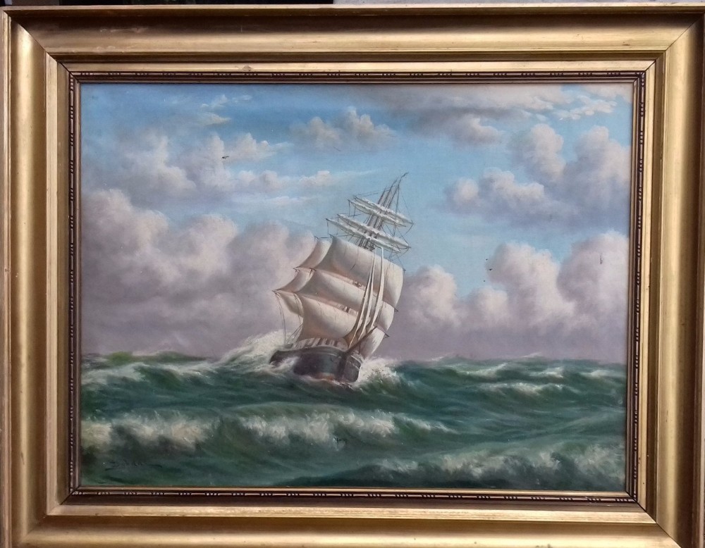 A 19th-century oil painting depicting a three-masted sailing ship navigating cresting green waves under a cloudy sky, displayed within a gilt moulding frame.