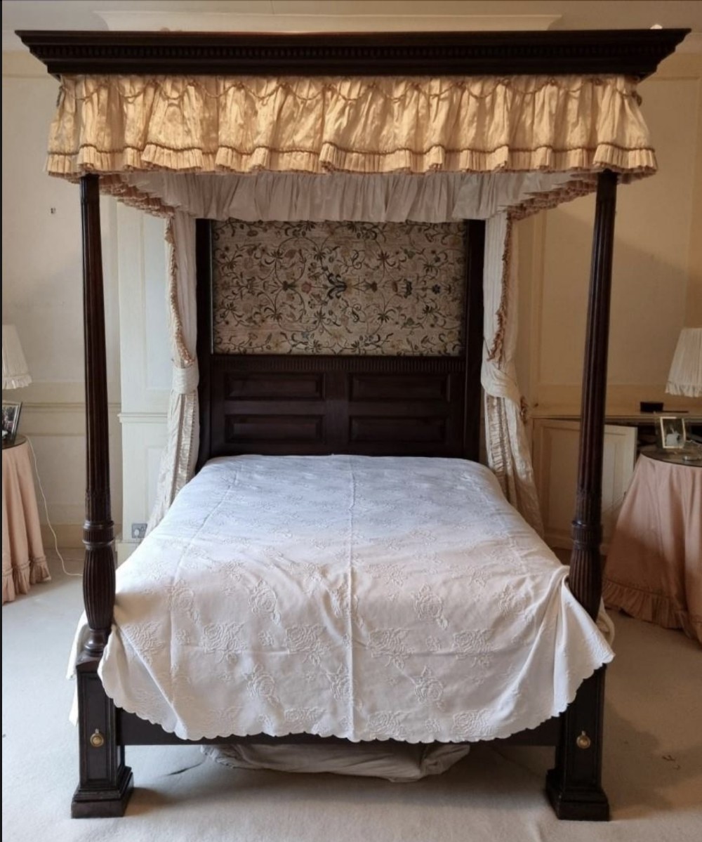 A George III style mahogany four poster bed