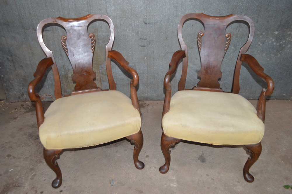 A pair of antique burr walnut low-seated armchairs with vasiform splats, carved cabriole legs, and yellow upholstered seats. View II