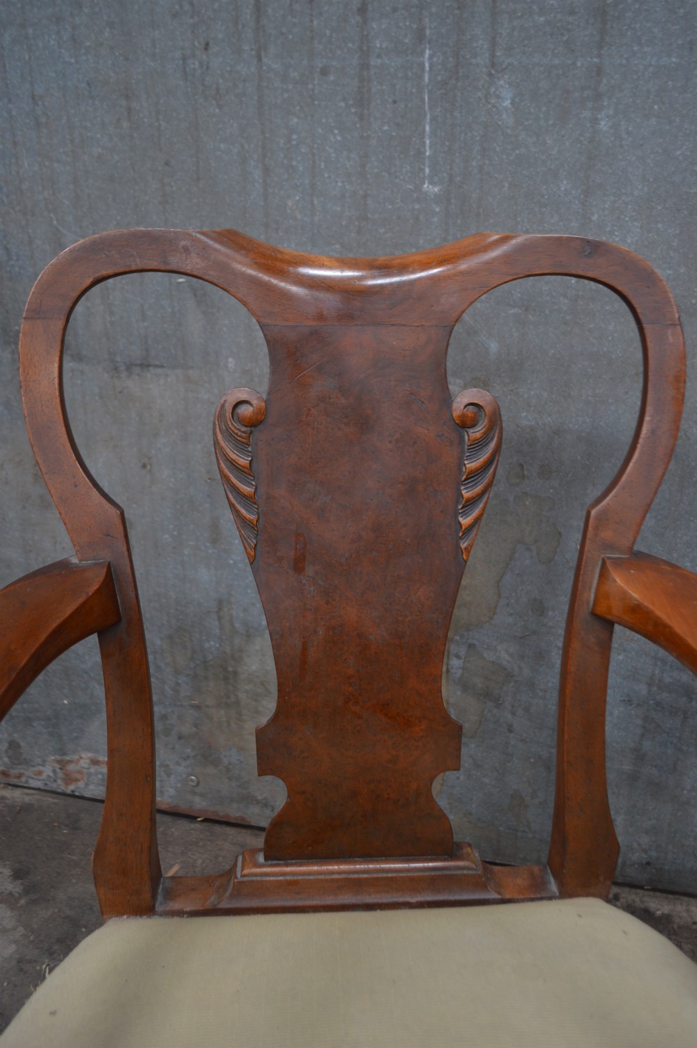 A pair of antique burr walnut low-seated armchairs with vasiform splats, carved cabriole legs, and yellow upholstered seats. View IV