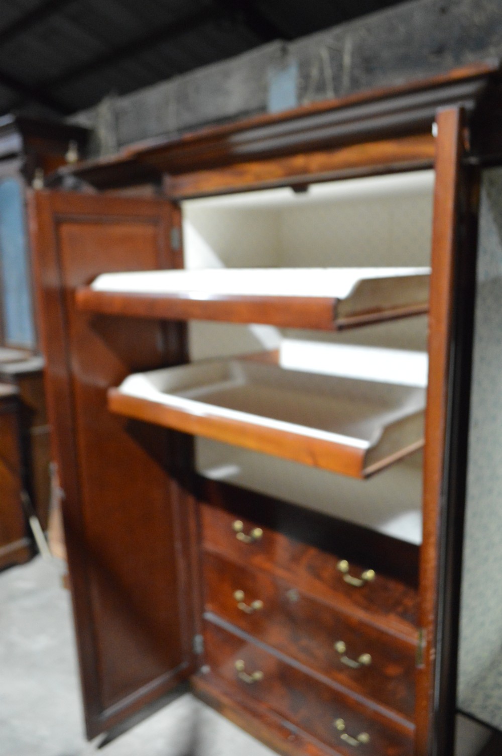 A nineteenth-century Victorian four-door breakfront wardrobe featuring flame mahogany panelled doors and a moulded top cornice. View VIII