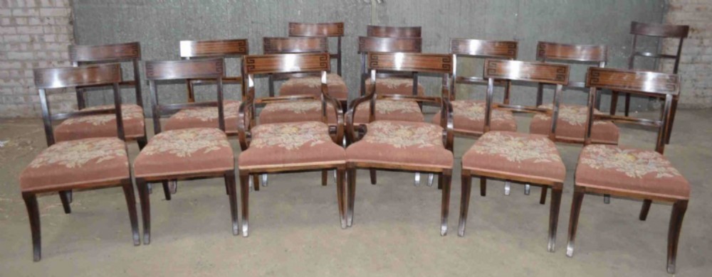Rare fine set of 14 Regency sabre legged mahogany dining chairs.