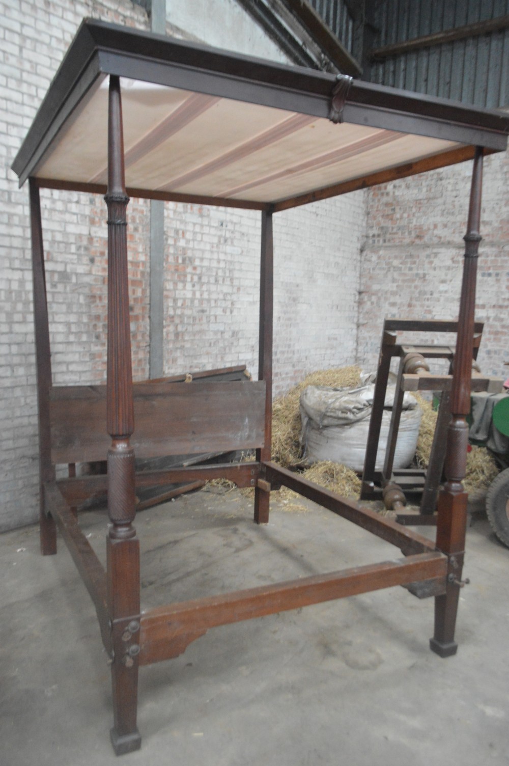A Regency period mahogany four poster bed frame.