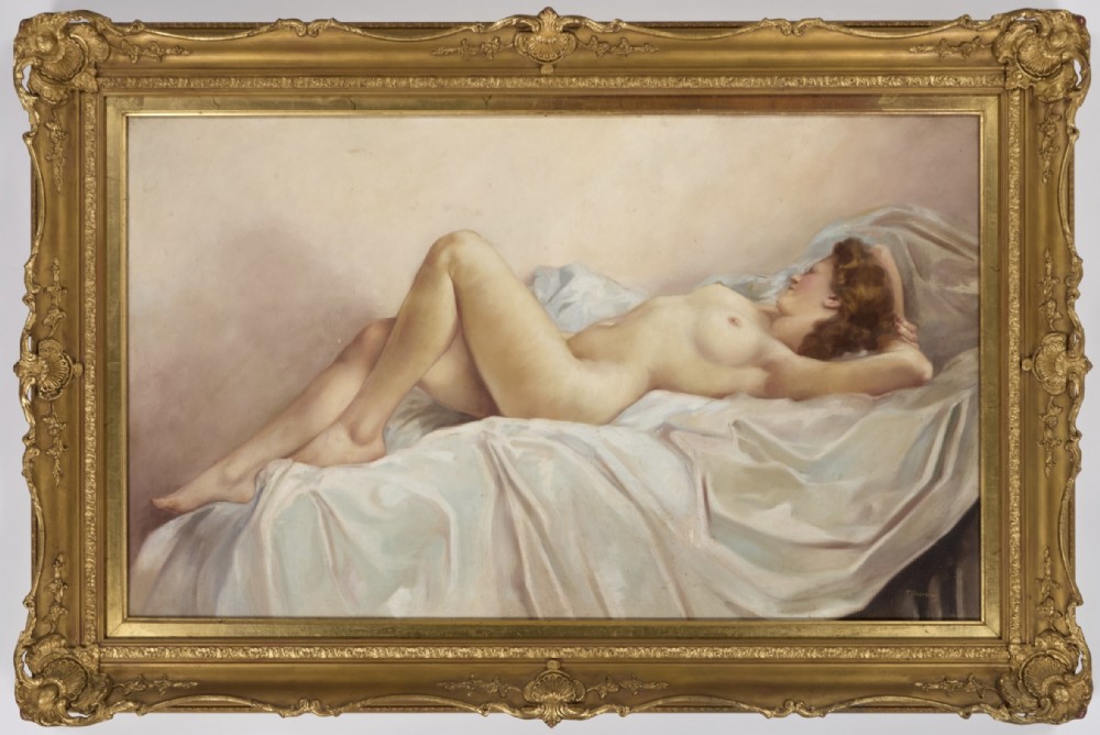 A large oil painting depicting a reclining classical female nude on draped white fabric, set inside an ornate gilded frame with corner shell motifs.