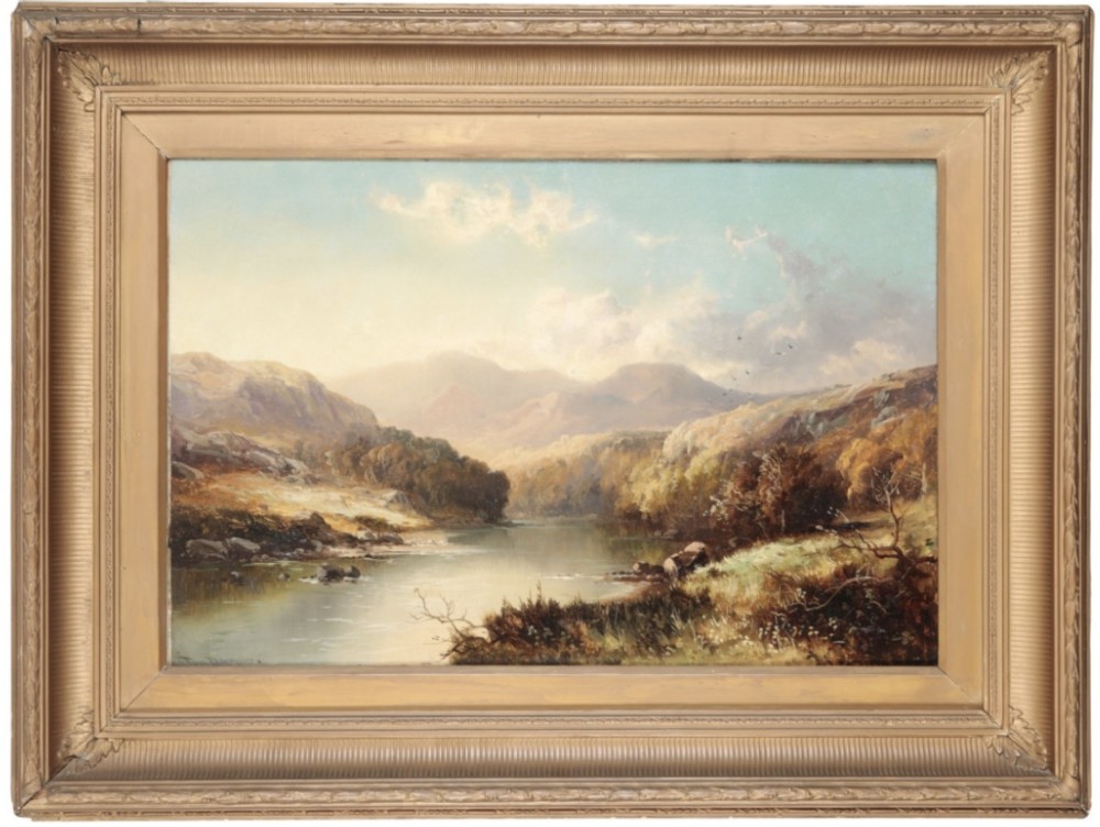 A Victorian landscape oil painting depicting a river running through mountains, presented within a molded giltwood frame.