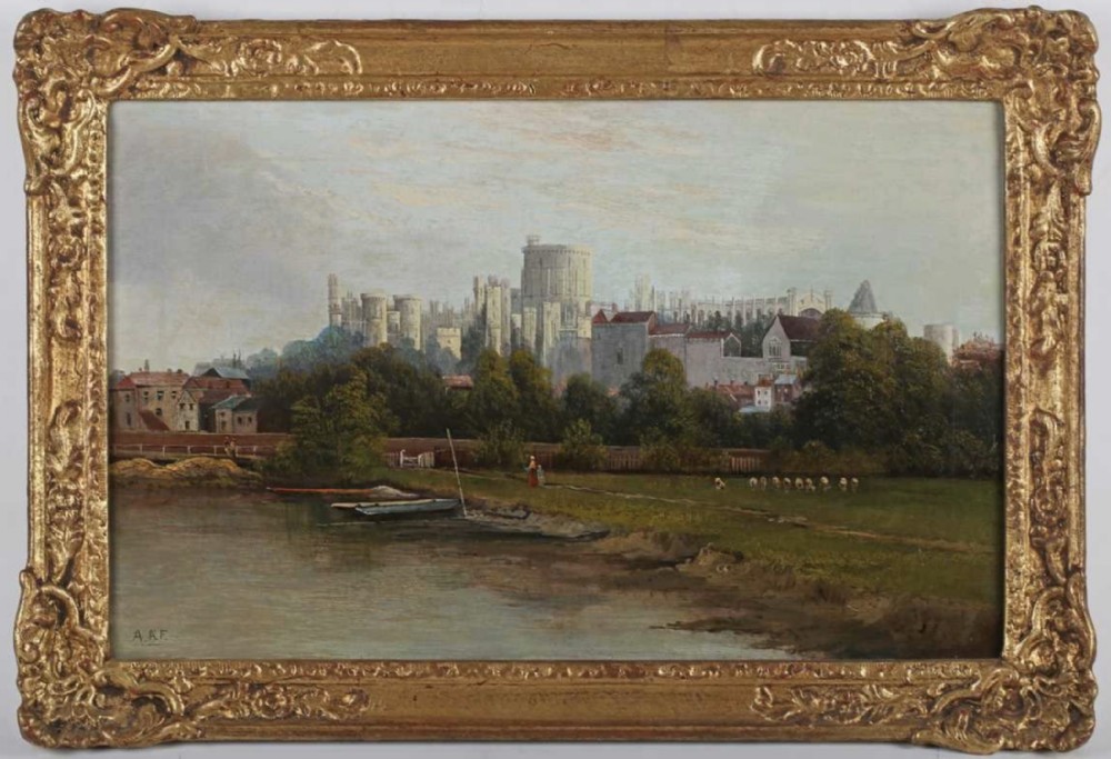 An antique 19th-century oil painting depicting Windsor Castle across a river, presented in an ornate gilt swept frame.