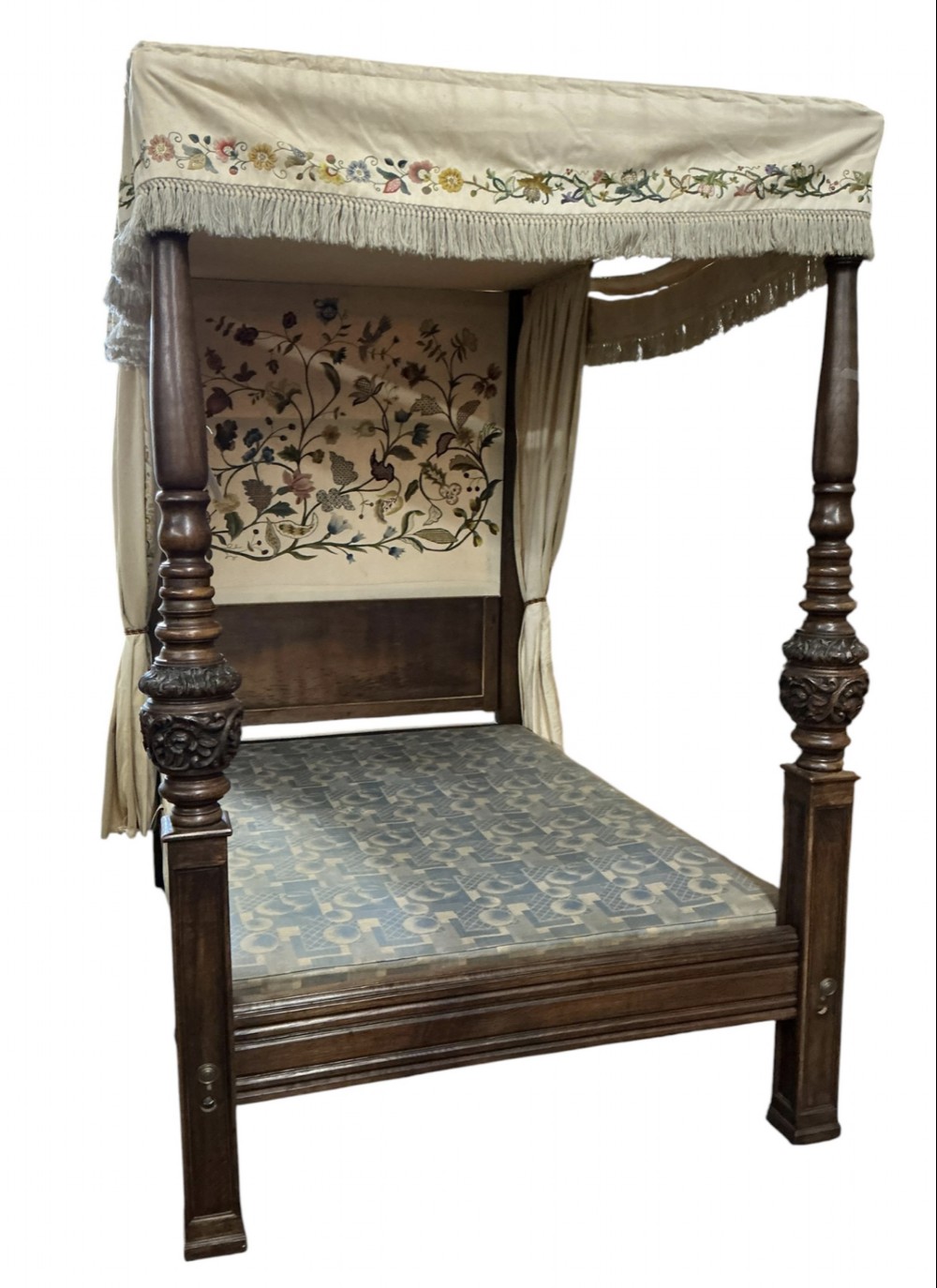 A 17th-century style carved oak half tester four-poster bed