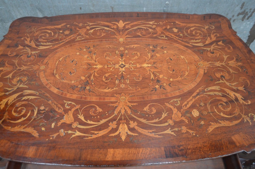 An 18th-century Dutch side table featuring floral marquetry inlay across a serpentine top, supported by cabriole legs with shell-carved knees and claw-and-ball feet. View IV