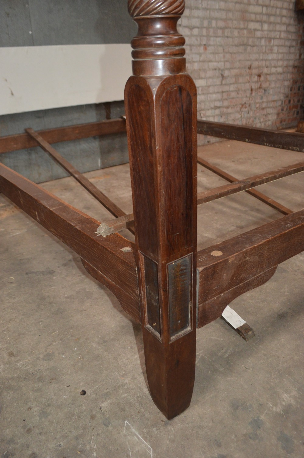 A dark mahogany Georgian four-poster bed frame featuring carved spiral-twist foot posts and a plain headboard panel. View V