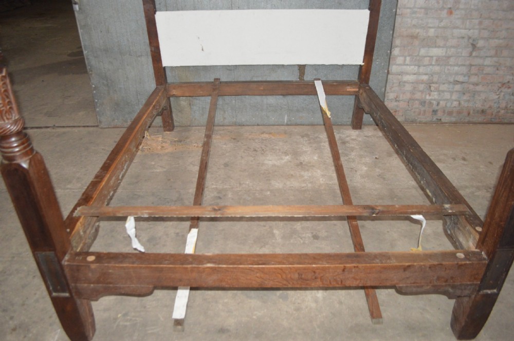 A dark mahogany Georgian four-poster bed frame featuring carved spiral-twist foot posts and a plain headboard panel. View VI