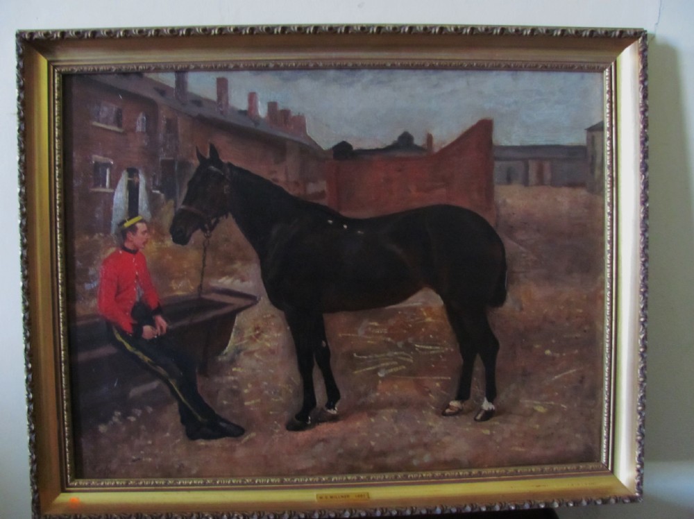 A 19th-century Victorian oil painting depicting a dark bay horse standing beside a seated soldier in a red military tunic, framed in gilt wood. View II