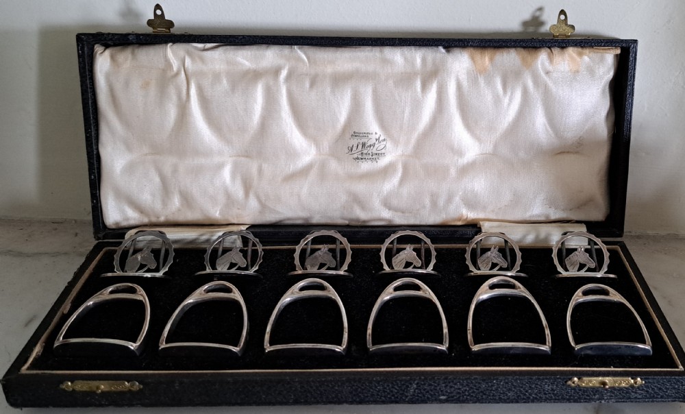 set of six silver napkin rings,and 6 placeholders horses head and stirrups View X