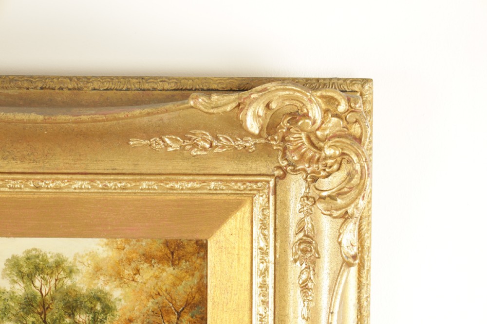 A 19th-century oil painting on canvas depicting a river, watermill, and distant mountains, housed within an ornate gilded frame. View IV