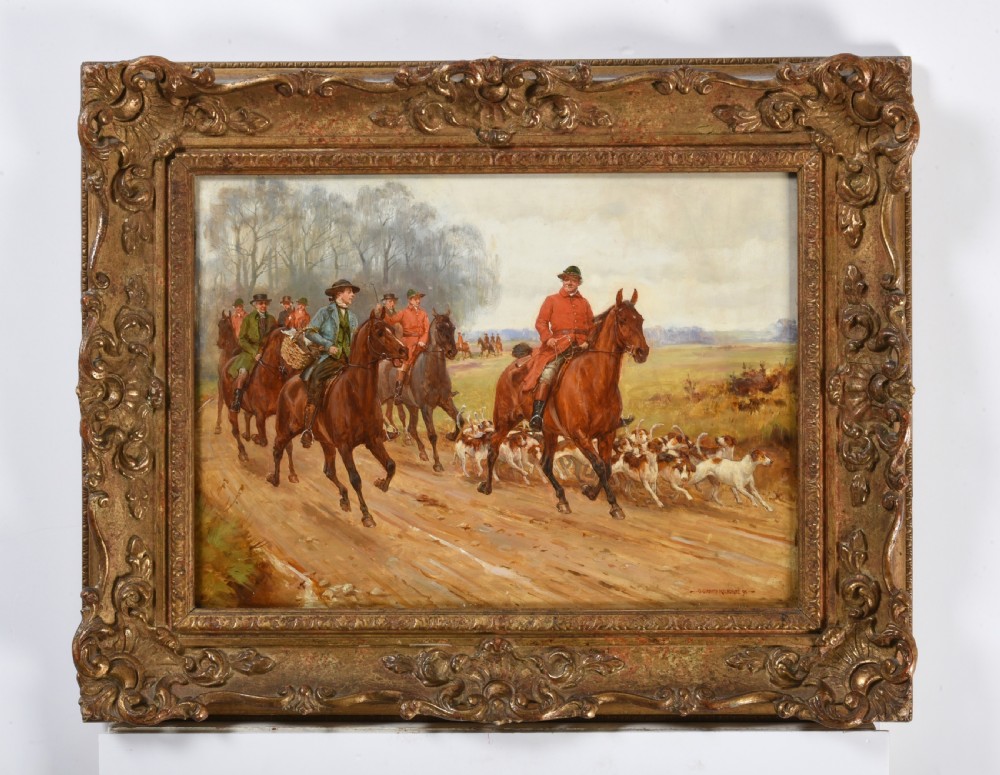 A nineteenth-century oil painting on canvas depicting fox hunters on horseback accompanied by hounds along a dirt path, enclosed in a carved gilt frame. View III