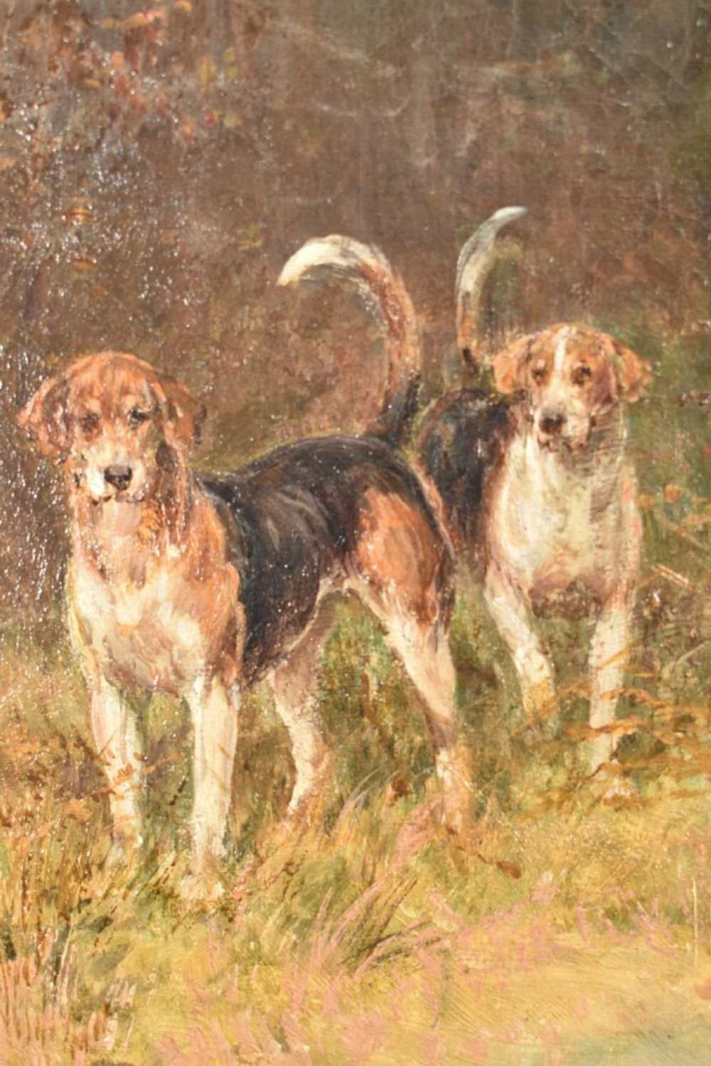 An oil painting depicting a mounted huntsman in a red jacket accompanied by foxhounds, set within an ornate gilded frame. View VI