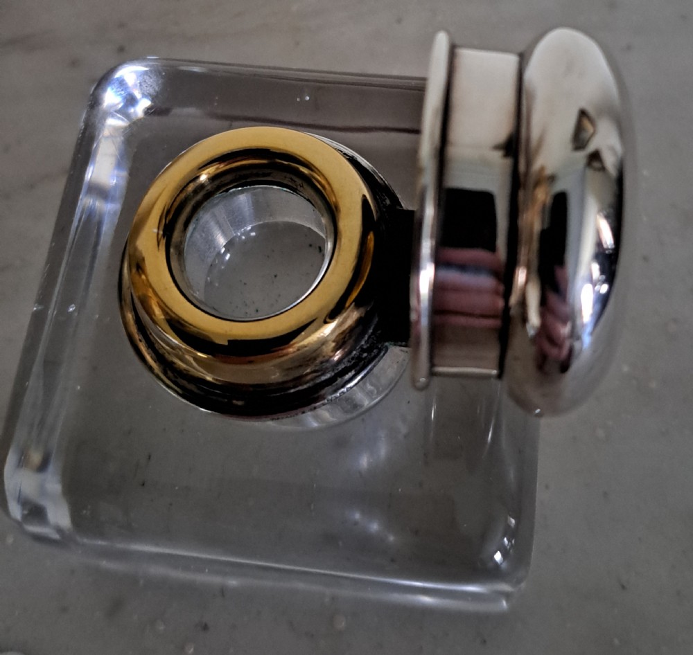 A square clear glass inkwell featuring a hinged silver dome lid with a gilded interior mechanism. View VII