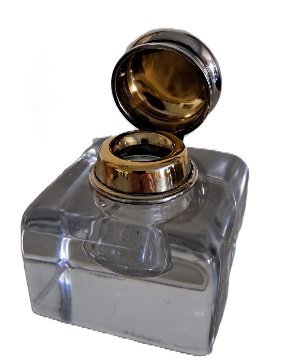 A square clear glass inkwell featuring a hinged silver dome lid with a gilded interior mechanism. View VIII