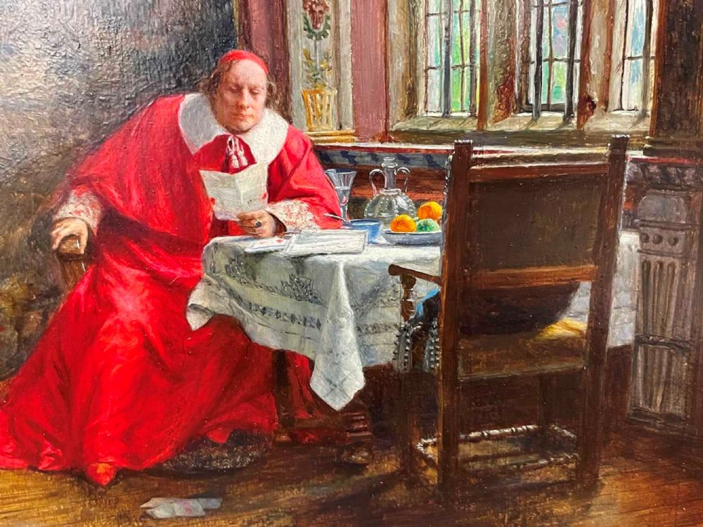An antique oil painting depicting a cardinal in red robes seated at a table beside a leaded glass window, set within an ornate gilded frame. View III