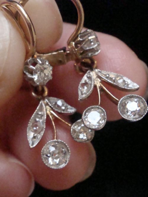 fig 1. A pair of French Edwardian 18ct yellow gold drop earrings featuring a botanical leaf design set with old cut diamonds.
