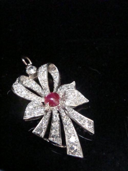EDWARDIAN PLATINUM RUBY AND DIAMOND BOW PENDANT