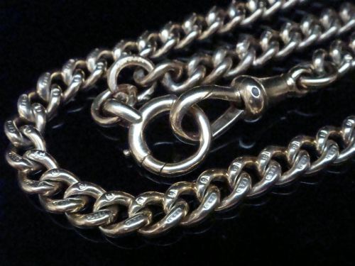 fig 1. An Edwardian 9ct yellow gold curb link chain featuring a swivel clip clasp and individual hallmark stamps on each link.