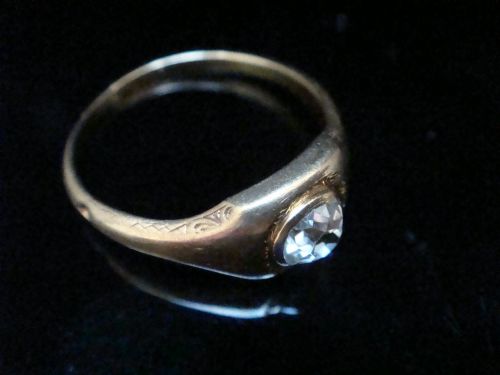 fig 1. A Victorian 18ct yellow gold gypsy ring set with a single old cut diamond in a flush rubover bezel with hand engraving.