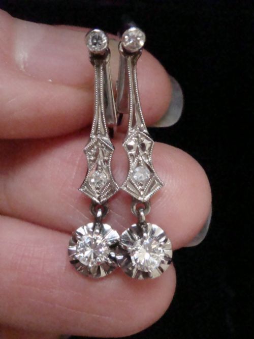 fig 1. A pair of vintage 18ct white gold diamond drop earrings featuring geometric milgrained links and suspended round old-cut diamonds.
