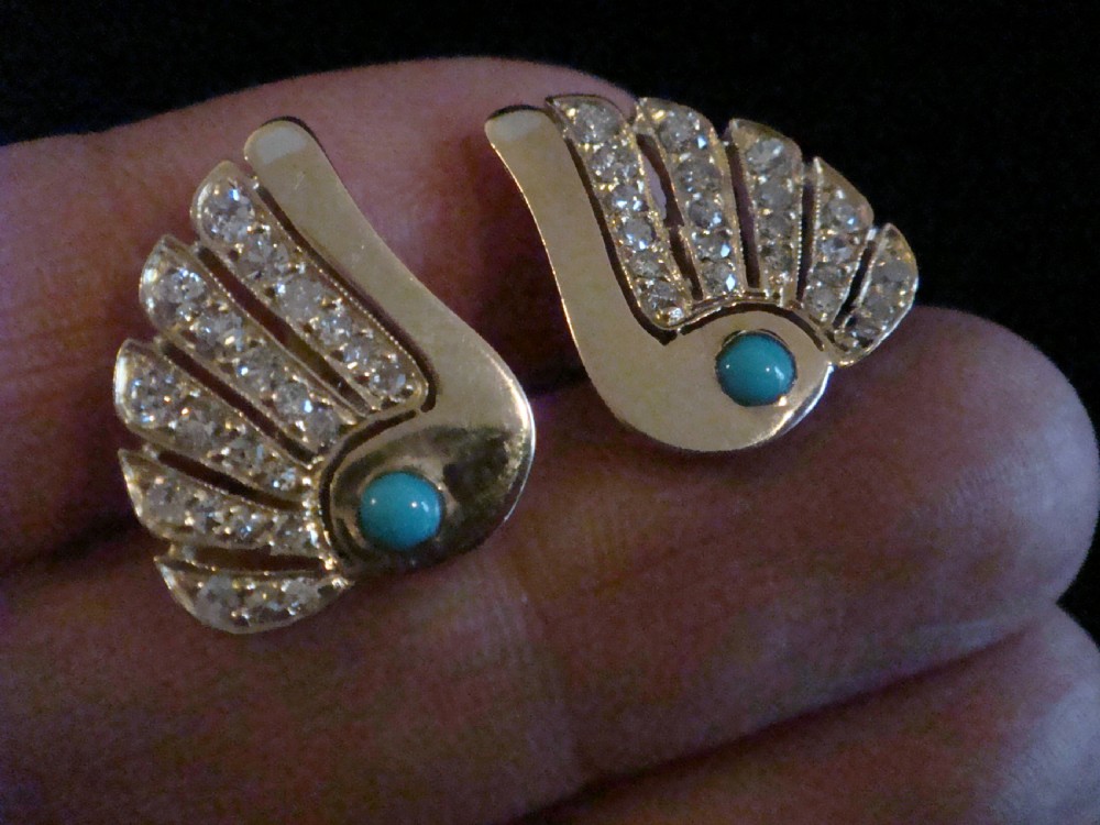 A pair of 1950s fan-shaped 18ct gold earrings set with round turquoise cabochons and rows of eight-cut diamonds. View II