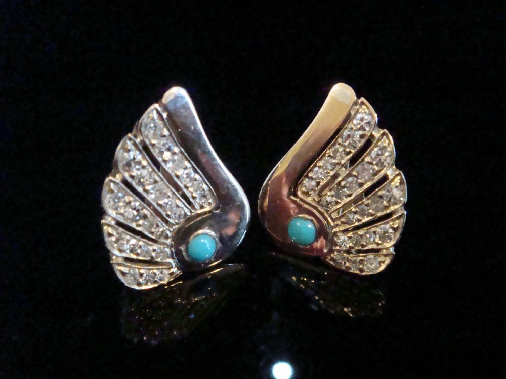 A pair of 1950s fan-shaped 18ct gold earrings set with round turquoise cabochons and rows of eight-cut diamonds. View III