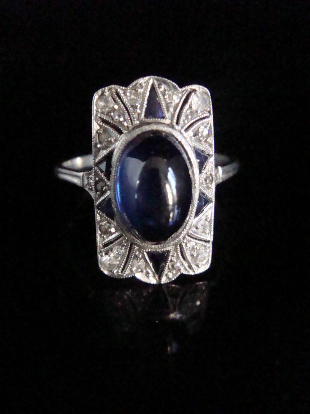 French Art Deco Platinum cabochon sapphire and old cut diamond pave set ring