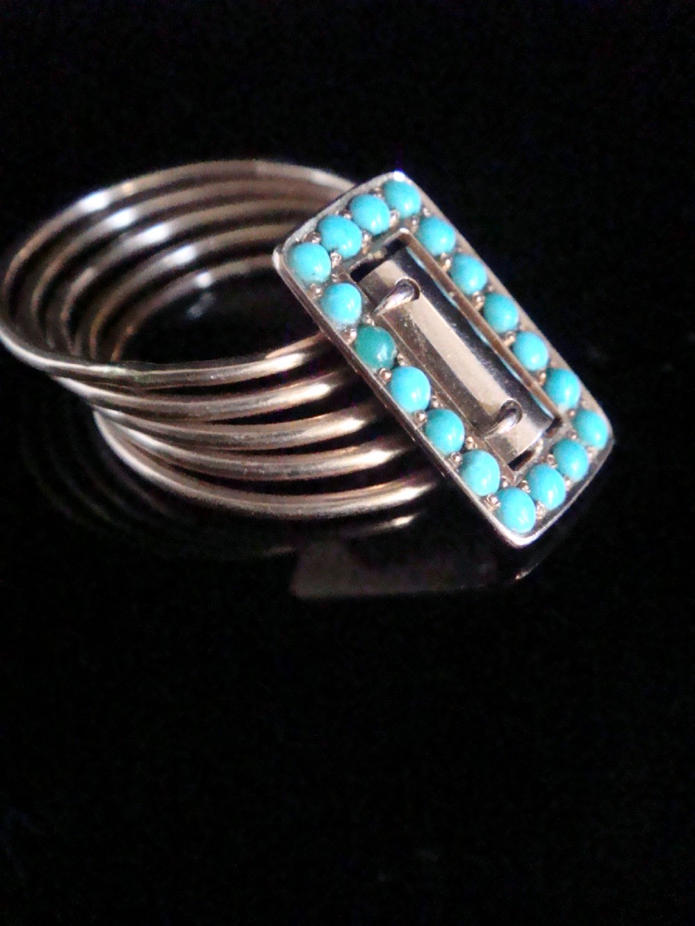A Victorian 18ct rose gold five-row harem ring featuring a central rectangular buckle motif set with circular turquoise cabochons. View V