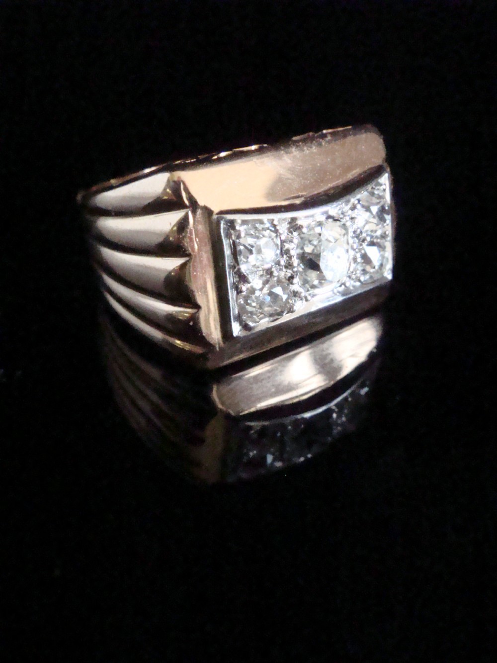 An 18ct yellow gold tank ring featuring a rectangular platinum panel set with bright diamonds. View II