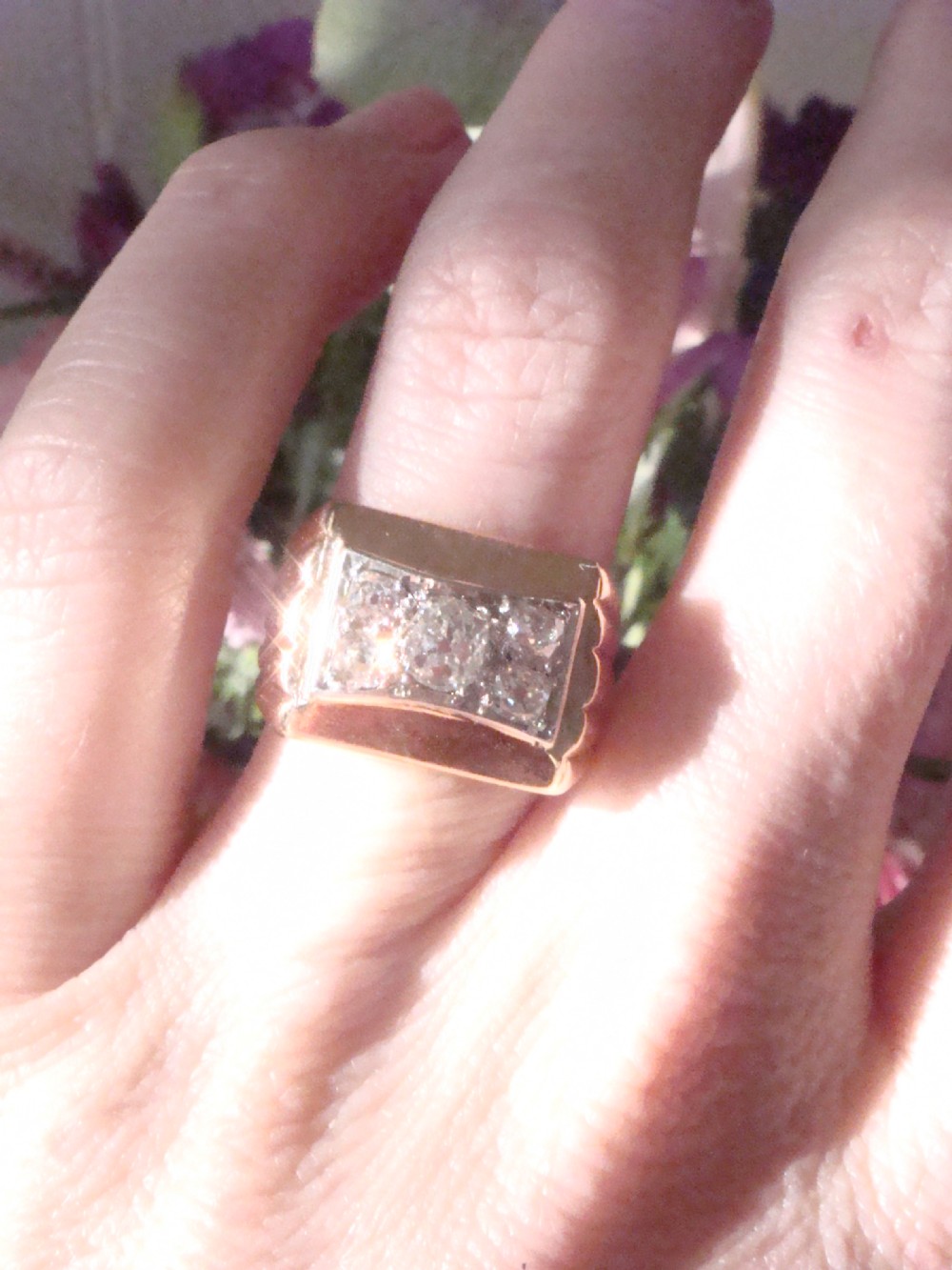 An 18ct yellow gold tank ring featuring a rectangular platinum panel set with bright diamonds. View IV