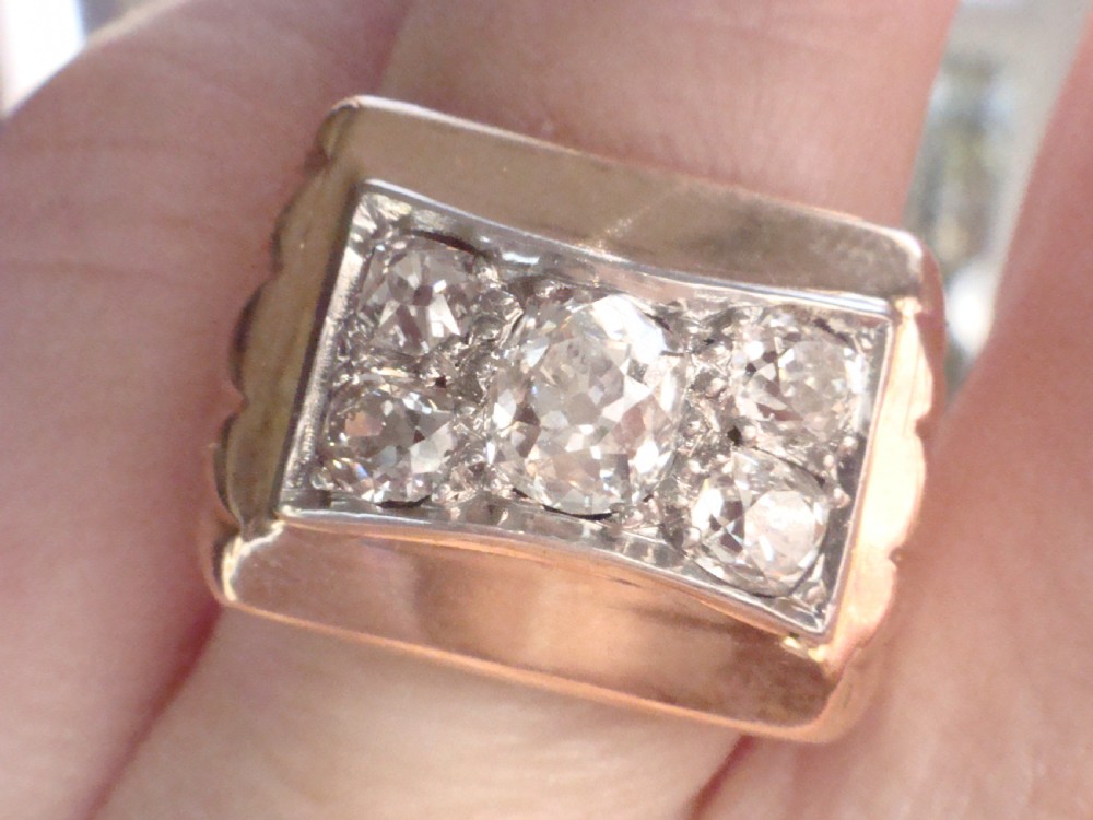 An 18ct yellow gold tank ring featuring a rectangular platinum panel set with bright diamonds. View VII