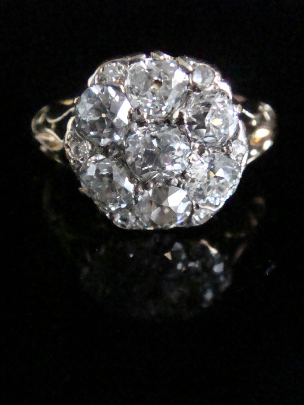 Victorian 18ct yellow gold ring featuring a multi-diamond cluster head and ornate scrollwork shoulders. View IV
