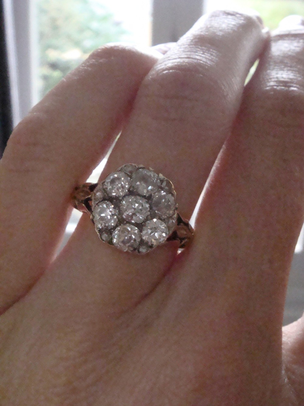 Victorian 18ct yellow gold ring featuring a multi-diamond cluster head and ornate scrollwork shoulders. View VIII
