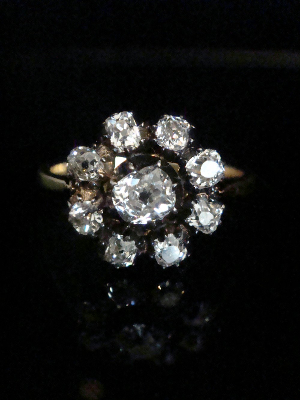 A Victorian 18ct yellow gold cluster ring featuring old mine cut diamonds arranged in a floral formation. View II