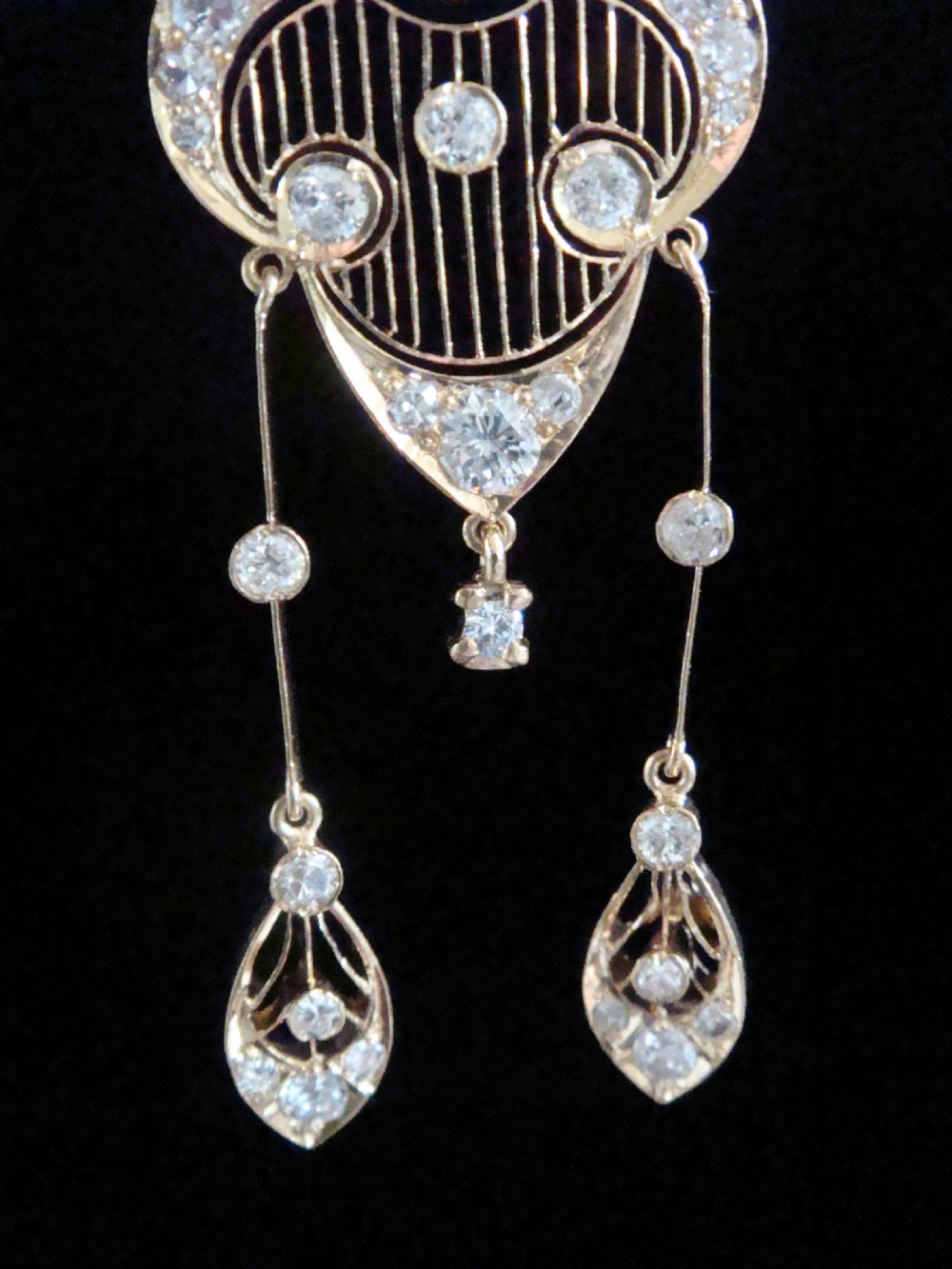 An ornate Victorian yellow gold pendant necklace set with round diamonds and black enamel accents, featuring two hanging diamond drop elements. View III