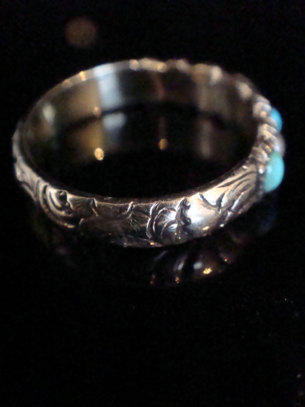 A Late Georgian 15ct gold half eternity ring featuring alternating round turquoise cabochons and pearls with hand-engraved details on the band. View II