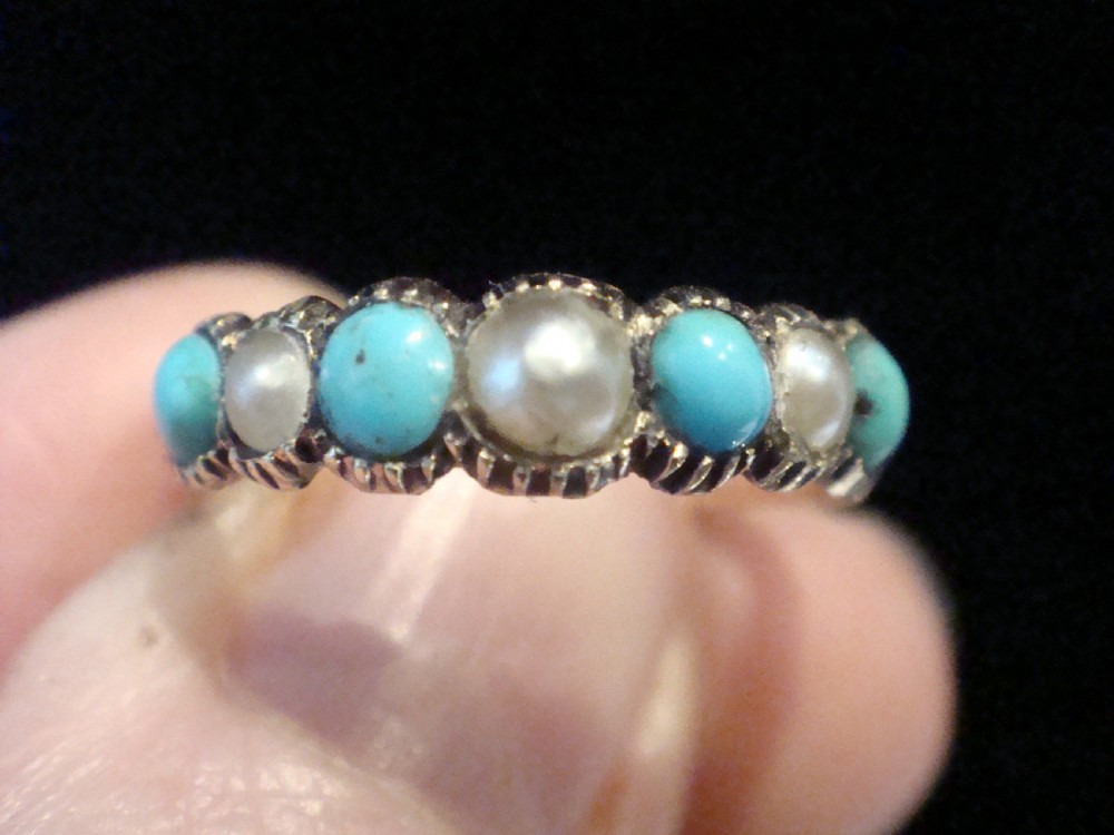 A Late Georgian 15ct gold half eternity ring featuring alternating round turquoise cabochons and pearls with hand-engraved details on the band. View III