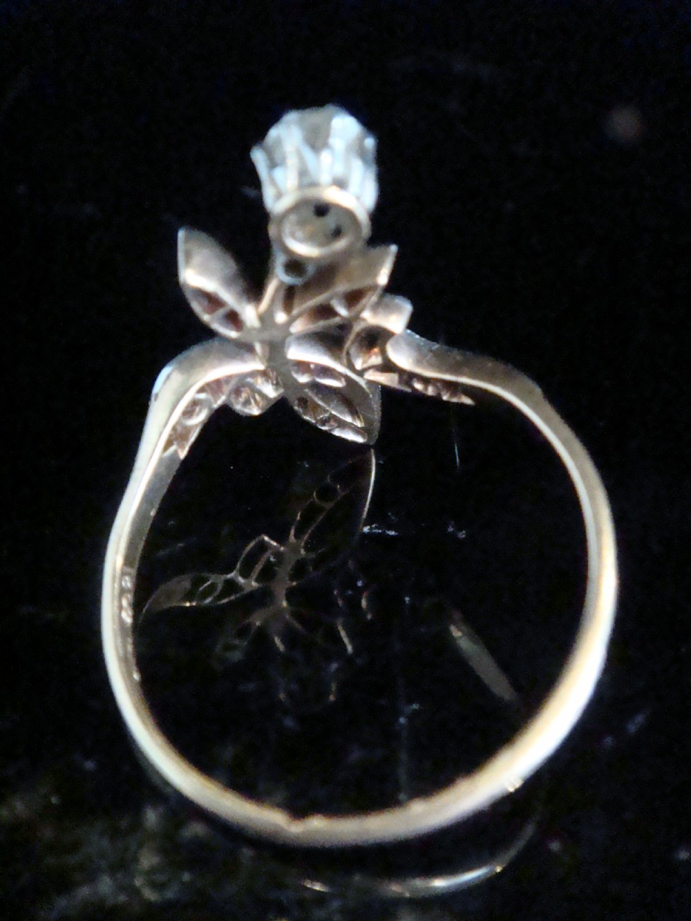 An Edwardian floral-shaped ring crafted in yellow gold and platinum, set with a central old cut diamond surrounded by diamond-encrusted leaf motifs. View III