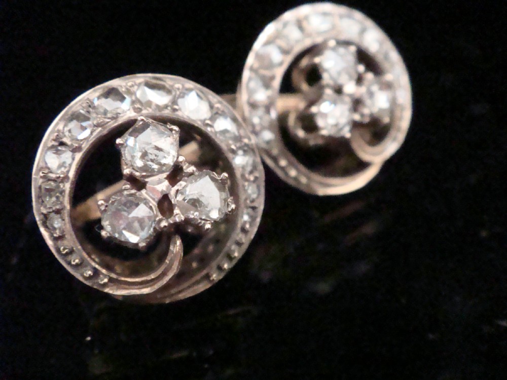 Pair of circular French Art Nouveau stud earrings featuring a central rose-cut diamond three-leaf clover framed by a diamond halo. View II
