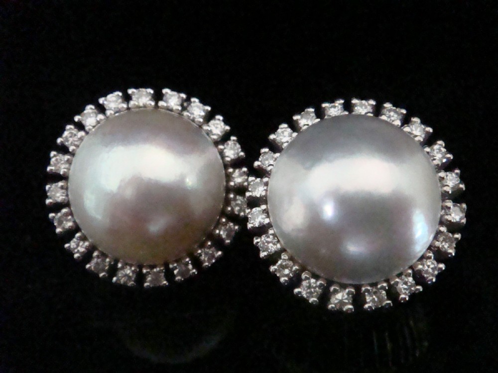 A pair of round Retro 14ct gold Mabe pearl cluster earrings encircled by a border of small brilliant-cut diamonds. View III