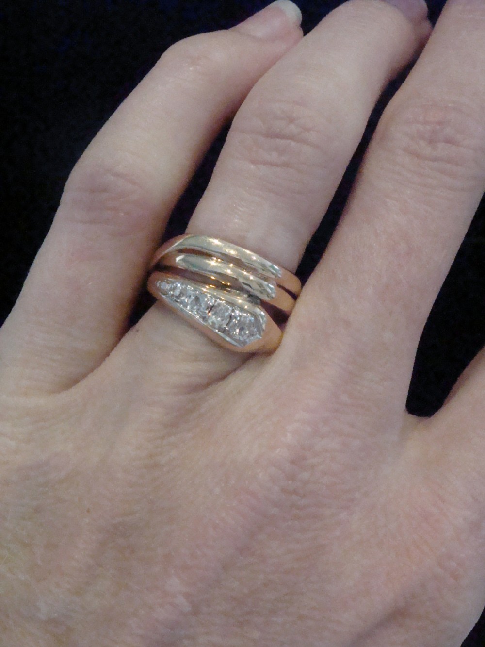A Victorian 18ct gold snake ring featuring a coiled band set with a line of five graduated old cut diamonds along the serpent head. View IV