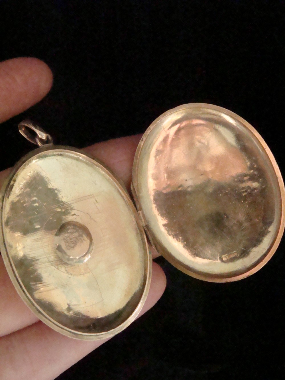 An oval 9ct rose gold Edwardian locket featuring a centrally inset starburst motif with a single seed pearl. View III